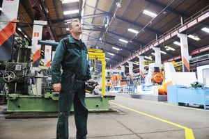 Engineer in a modern IIoT connected factory